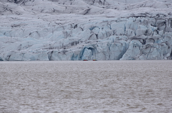 Zodiacs passing front of Fjalljokull glacier