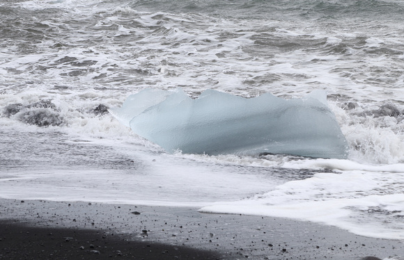 Iceberg in surf, Jokulsarlon